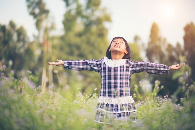 Little girl raising hand refresh in the air