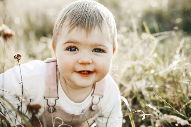 Little girl's portrait close up on the lawn