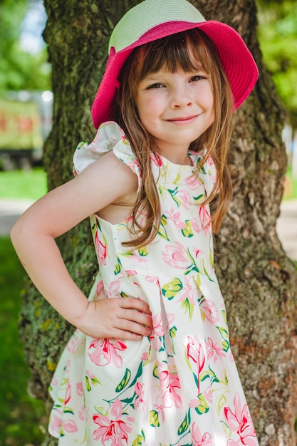 Little girl smiling with hands on hips