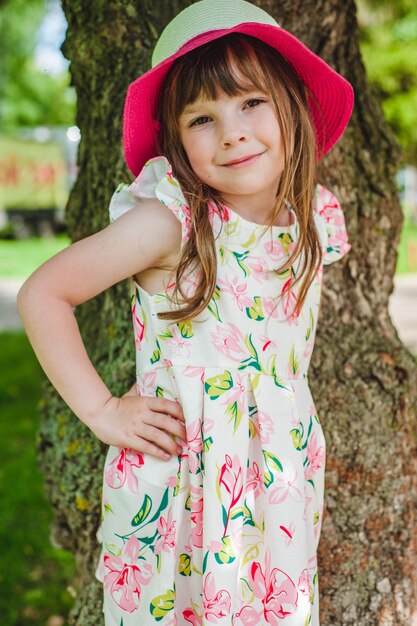 Little girl smiling with hands on hips