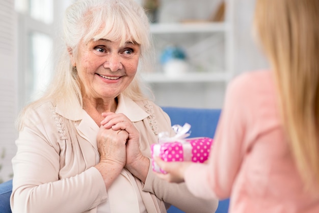 Little girl surprising grandma