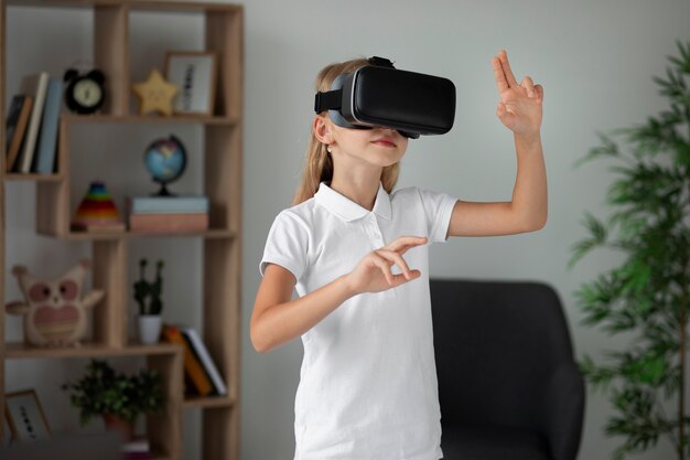 Little girl using virtual reality goggles