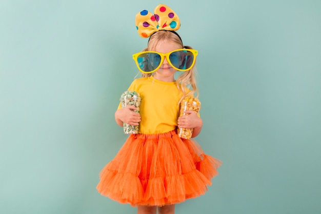 Free Photo little girl with candy and big sunglasses