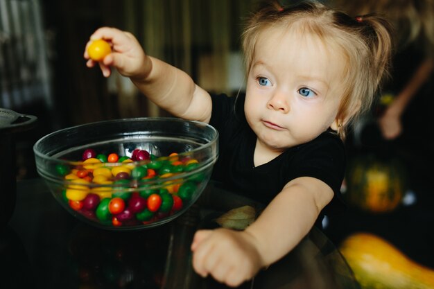 Little girl with a candy in her hand