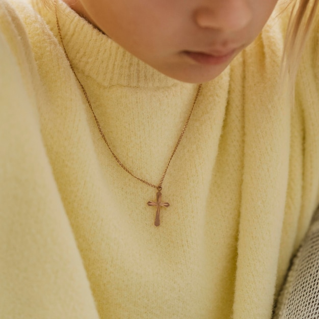 Little girl with cross necklace