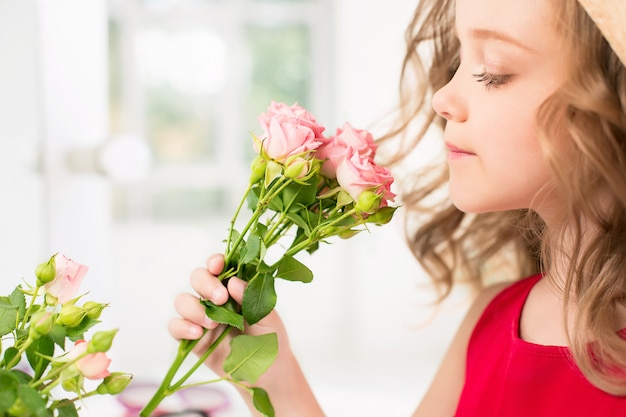 A little girl with roses