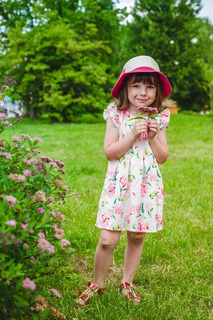 Little girl with some flowers in her hand