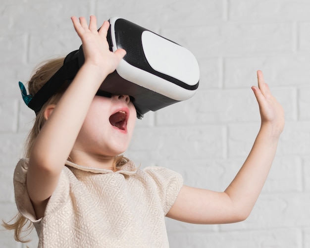 Little girl with virtual reality headset