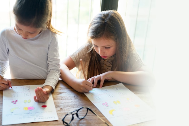 Free Photo little girls homeschooling during coronavirus pandemic