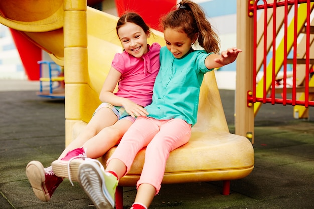 Free photo little girls playing in the playground