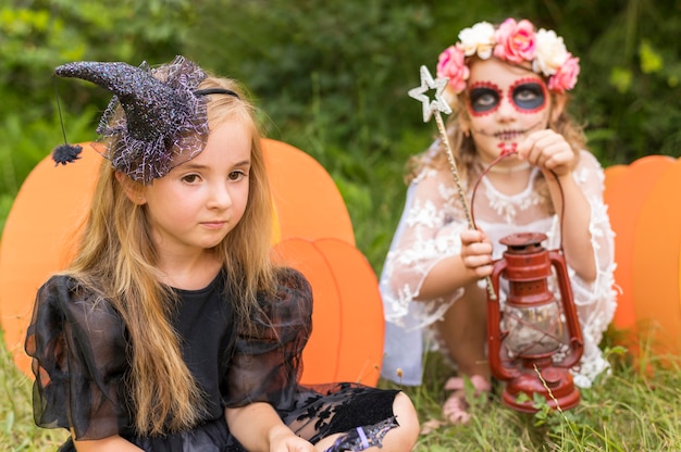 Free Photo little girls with costumes for halloween