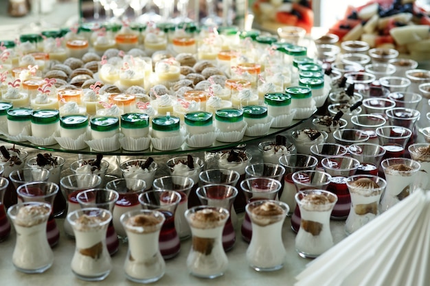 Free photo little glasses with cold desserts stand side by side