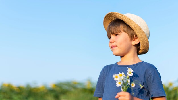 Little kid holding flowers