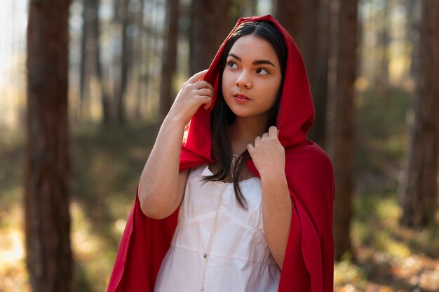 Little red riding hood in the forest portrait