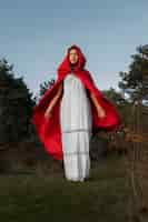 Free photo little red riding hood in a white dress