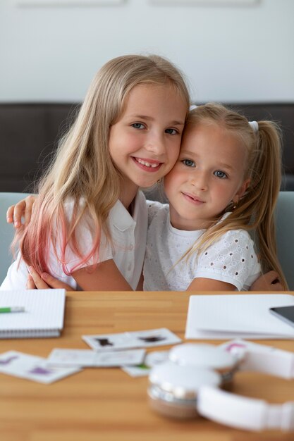 Little sisters doing online school together at home