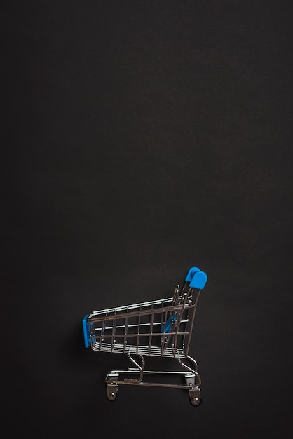 Free photo little toy shopping trolley