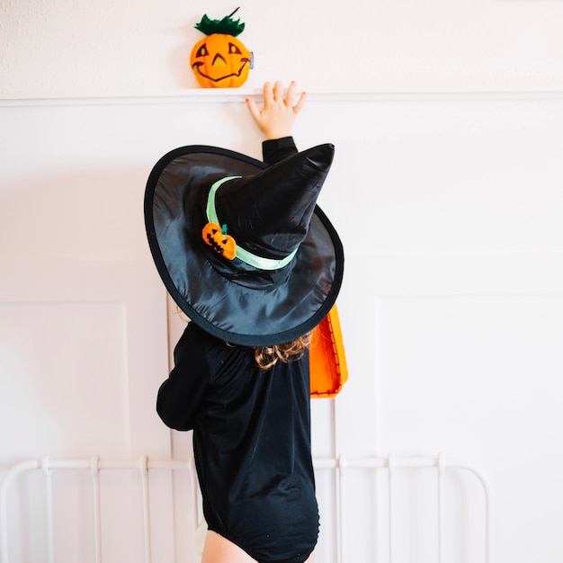 Free Photo little witch and jac-o-lantern