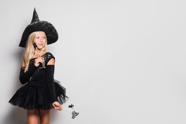 Free Photo little witch with wands