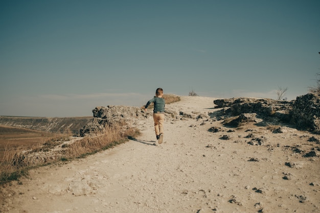 Little young caucasian boy in nature, childhood