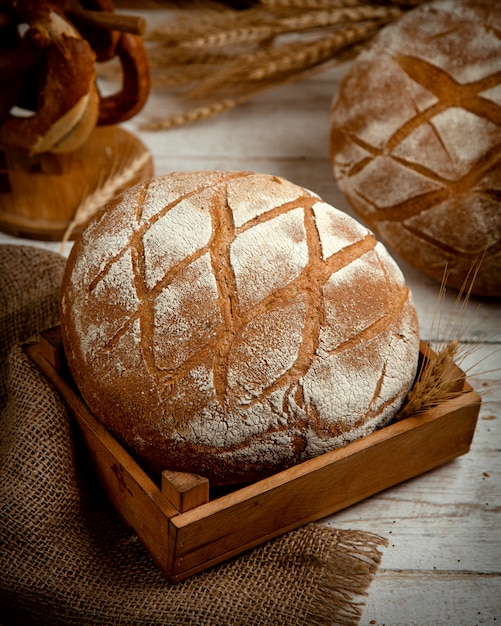 Loaf of bread topped with flour _