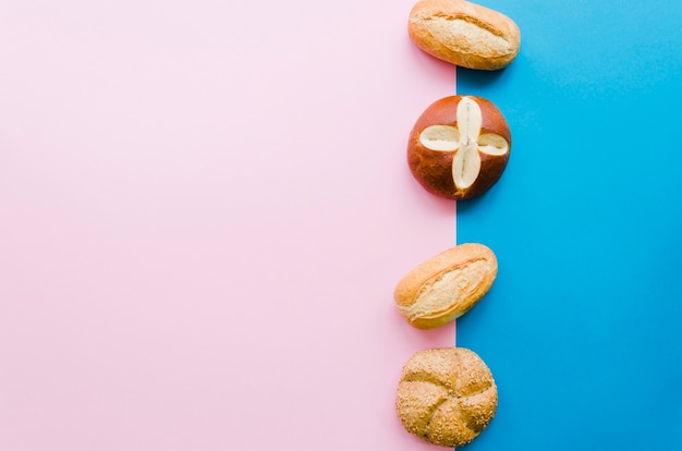 Free photo loaf of bread with color background