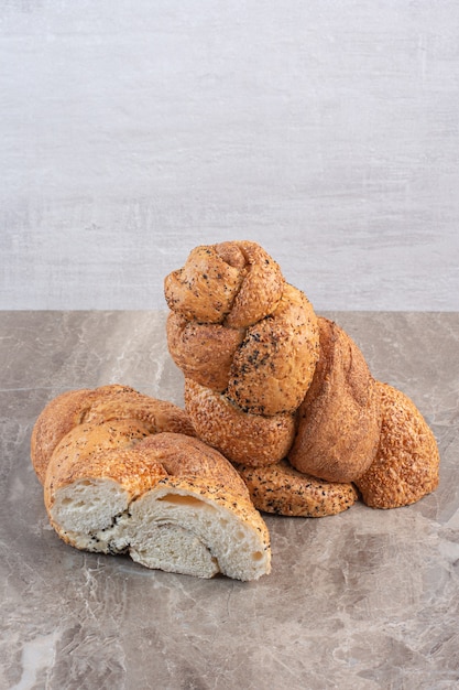 Loaf of strucia bread sliced in two on marble.