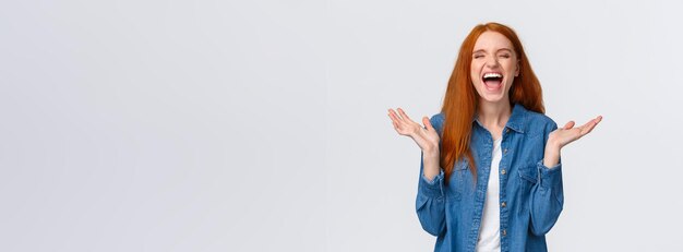 Free photo lol so funny amused and carefree pretty redhead female student clap hands applause with closed eyes