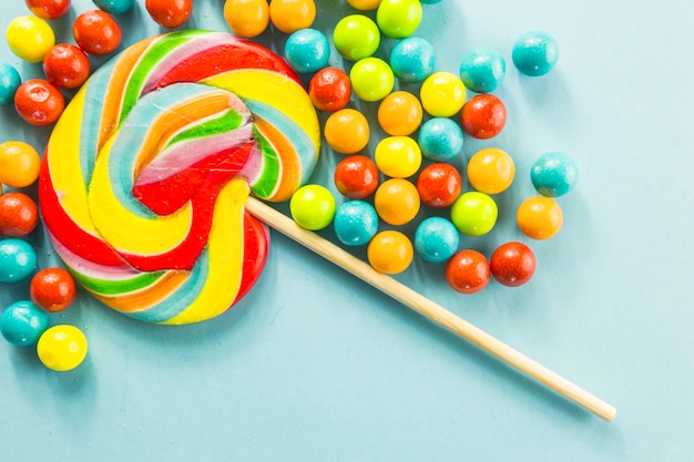 Lollipop amidst candy drops