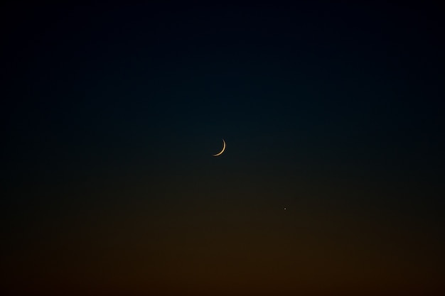 Free Photo lonely moon in dark night sky