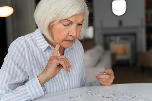 Free photo lonely woman confronting alzheimer disease