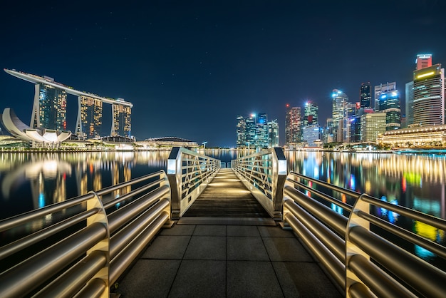 Free Photo long bridge between illuminated city at night