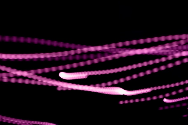 Free Photo long exposure of pink light trail over black backdrop