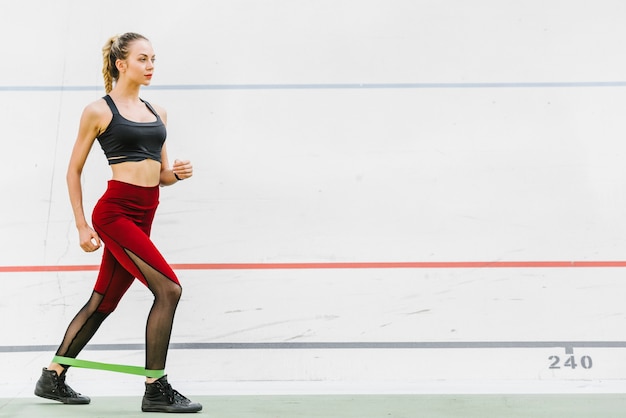 Long shot of athlete with elastic band