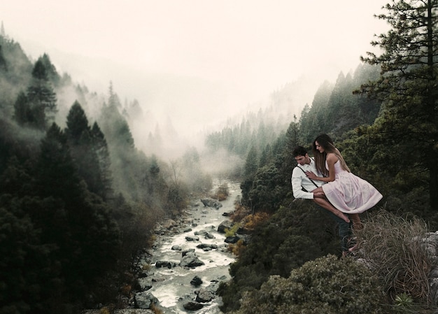 Long shot couple levitating in nature