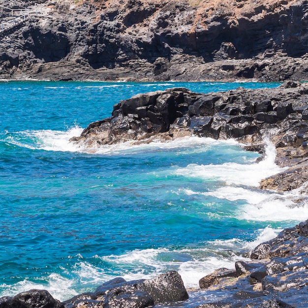 Long shot crystalline water on wild beach