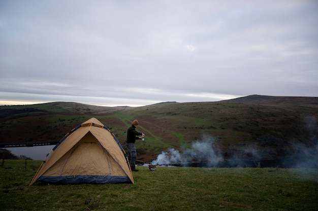 Free photo long shot explorer with tent