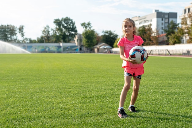 Long shot of girl holding a ball