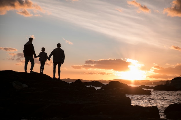 Free photo long shot lgbt family at sunset