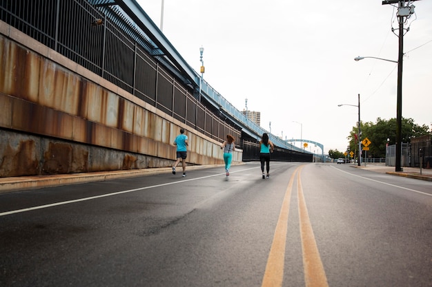 Long shot people running on street