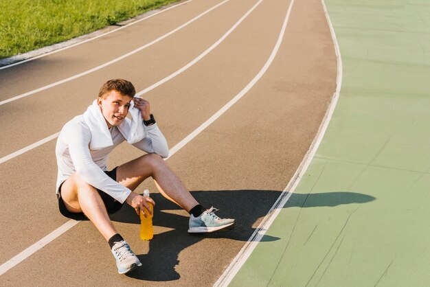 Long shot of runner taking a break