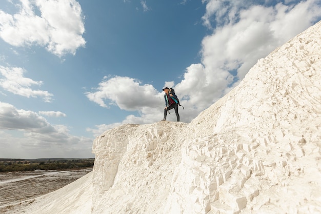 Free photo long shot traveler on a mountain