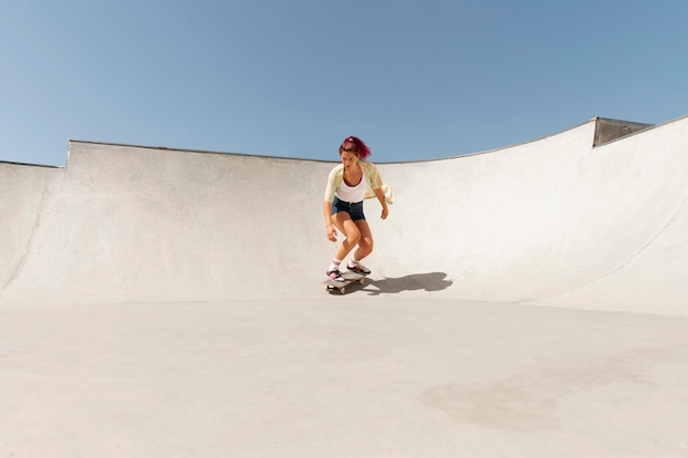 Long shot woman on skateboard