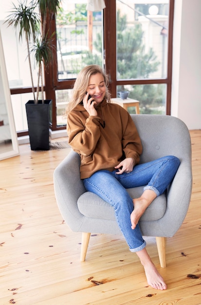 Long shot of woman talking at phone