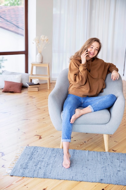 Long shot of woman talking at phone