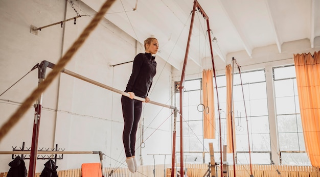 Long shot woman training for gymnastics championship