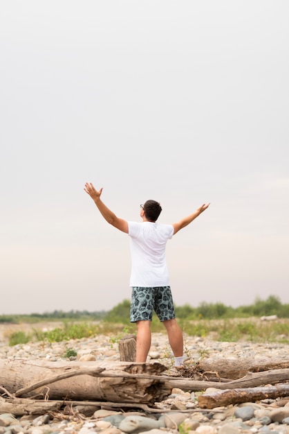 Long shot of young man looking away