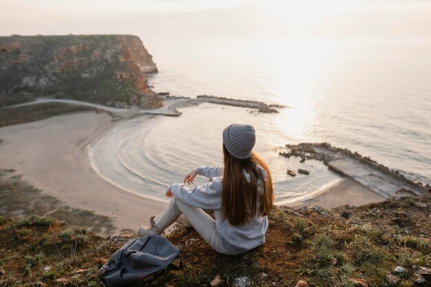 Long shot of young woman enjoying the peace around her