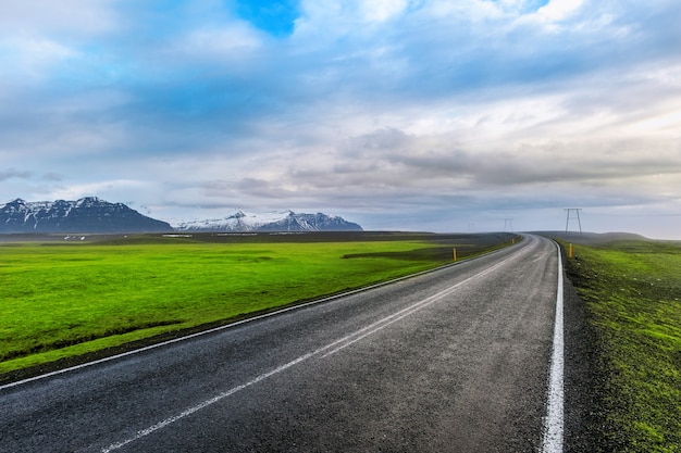 Free photo long straight road and blue sky.