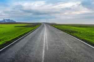 Free photo long straight road and blue sky.